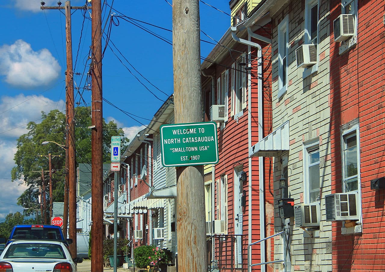 Row homes with window air conditioners along a street in North Catasauqua, Pennsylvania